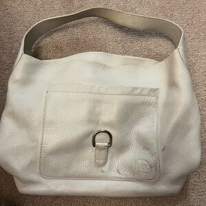 Dooney and Bourke Hobo, off white, silver details. Well loved. See pics.